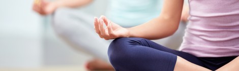 young people meditating indoors
